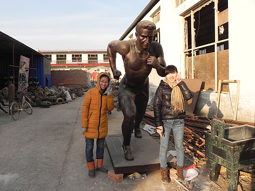 Bronze runner sculpture