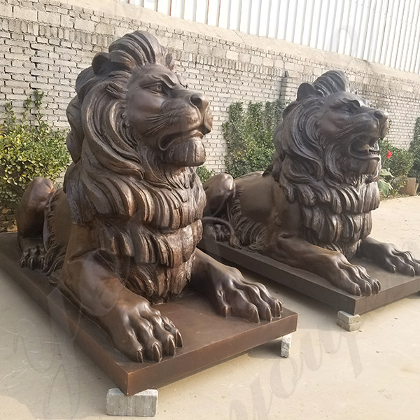 Bronze sitting lion sculpture